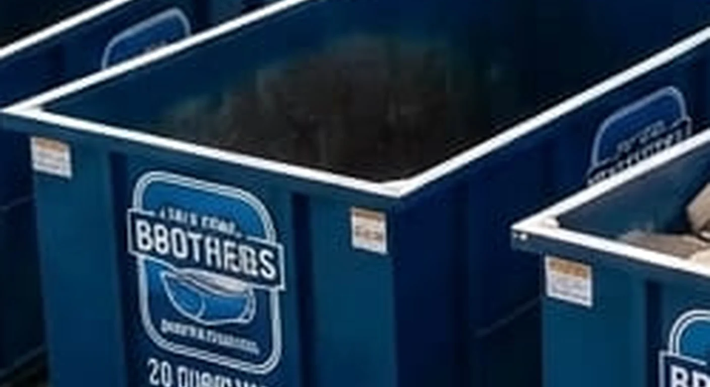 A clean, correctly-labeled 20 yard Cape Coral Brothers Dumpster Rental roll-off container staged at the company yard
